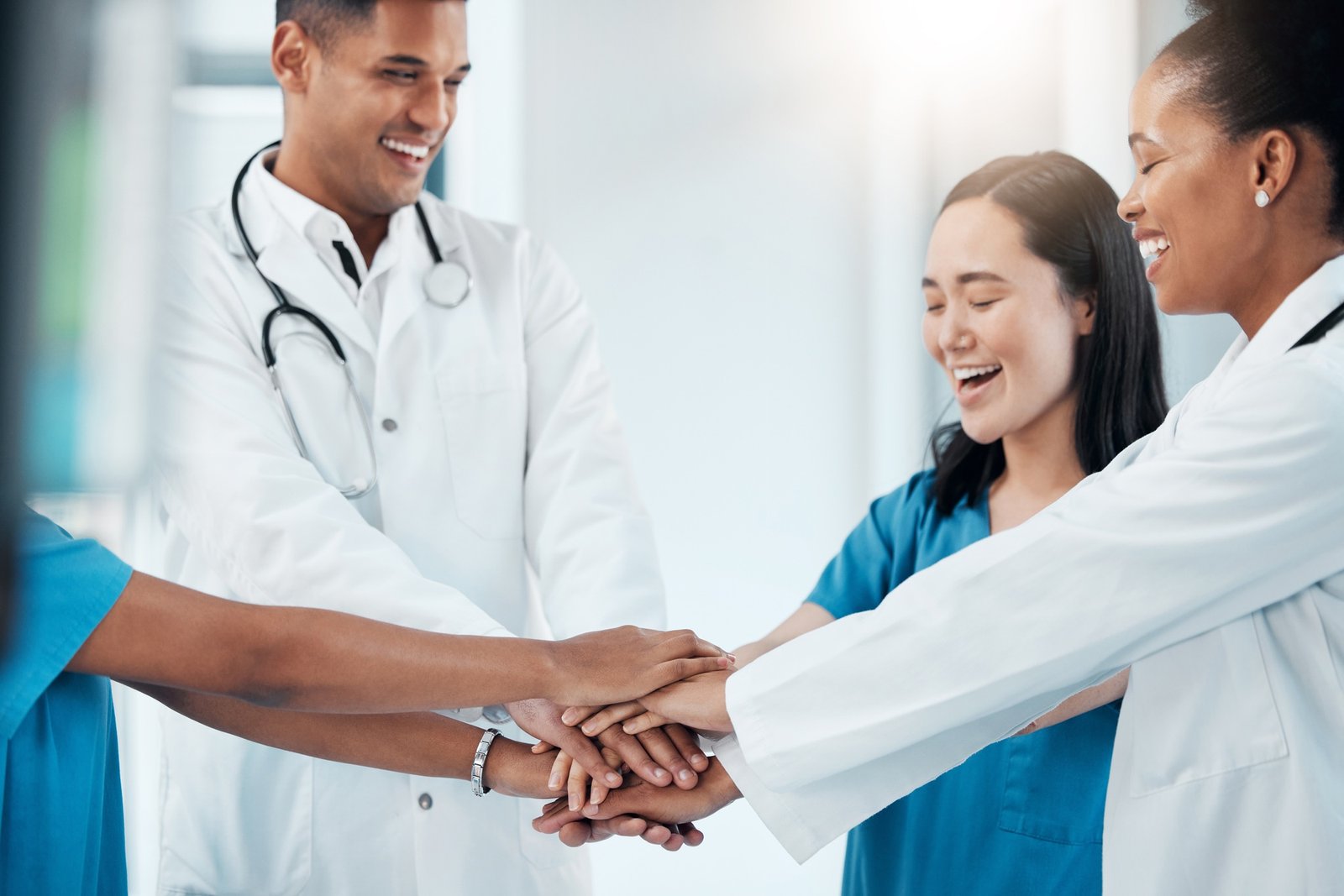 Collaboration, doctors and hands in support of healthcare, mission and goal motivation in a hospita