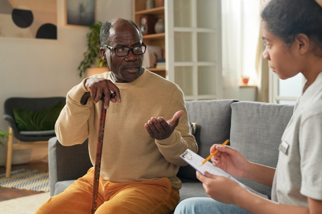 Discussing Care Plan with Caregiver at Cozy Living Room